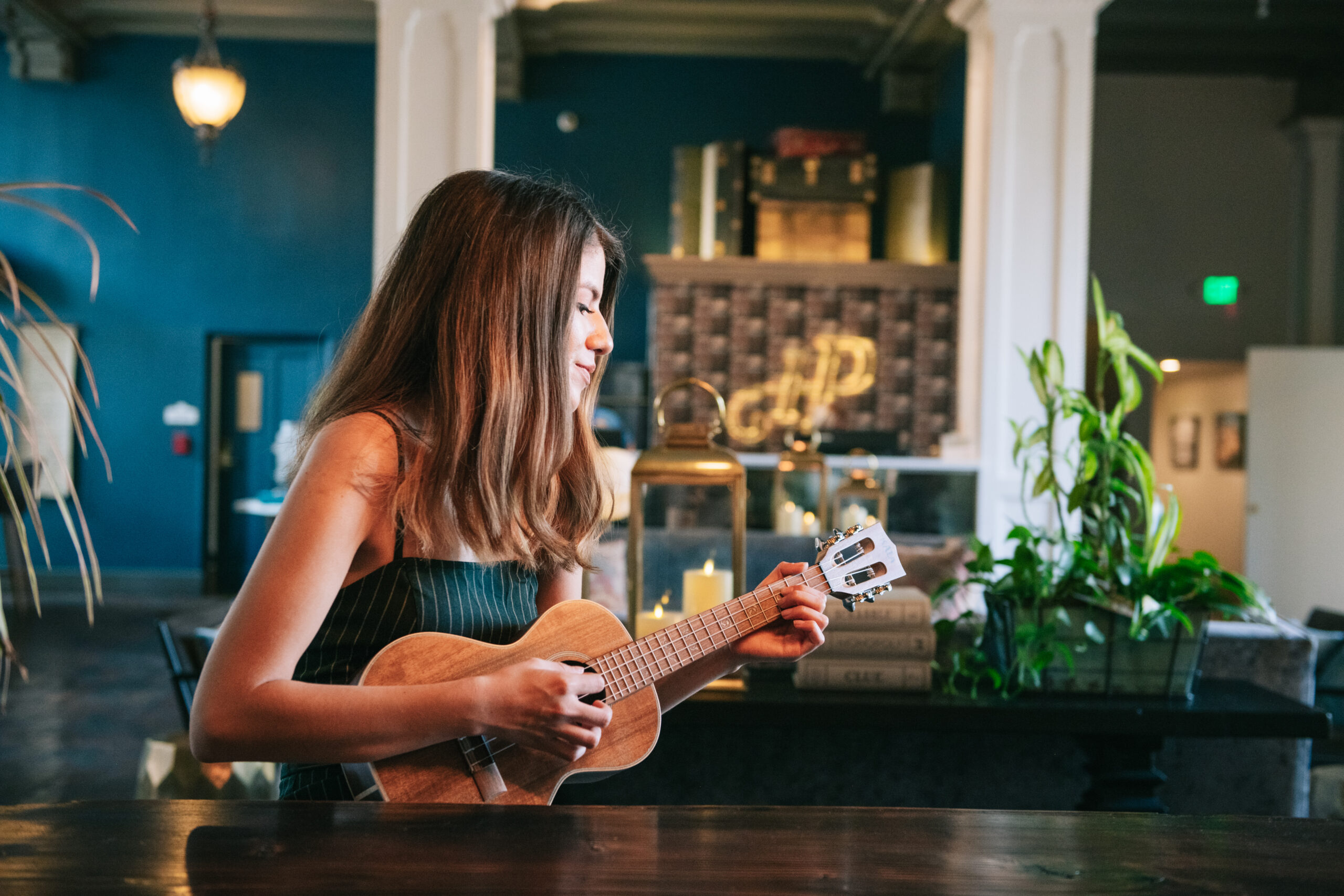 Woman learning to play ukulele